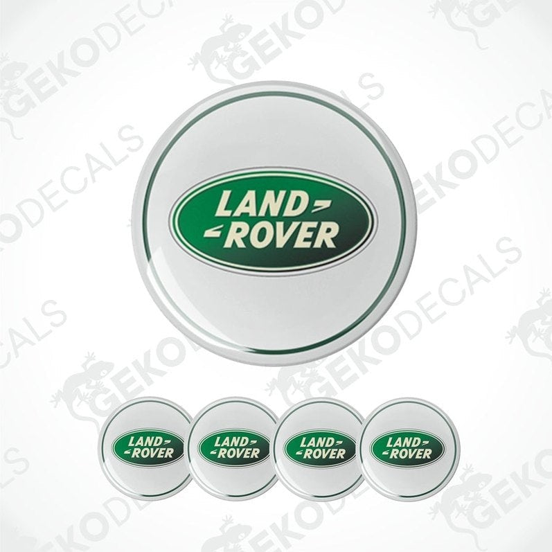 A set of four white vinyl stickers with the 'Land Rover' brand logo in green, displayed on a white background.