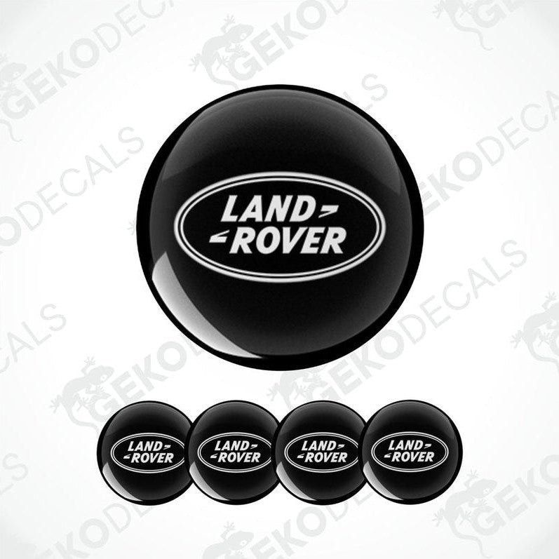 A set of four black vinyl stickers with the 'LAND ROVER' text embossed on them, displayed against a white background.