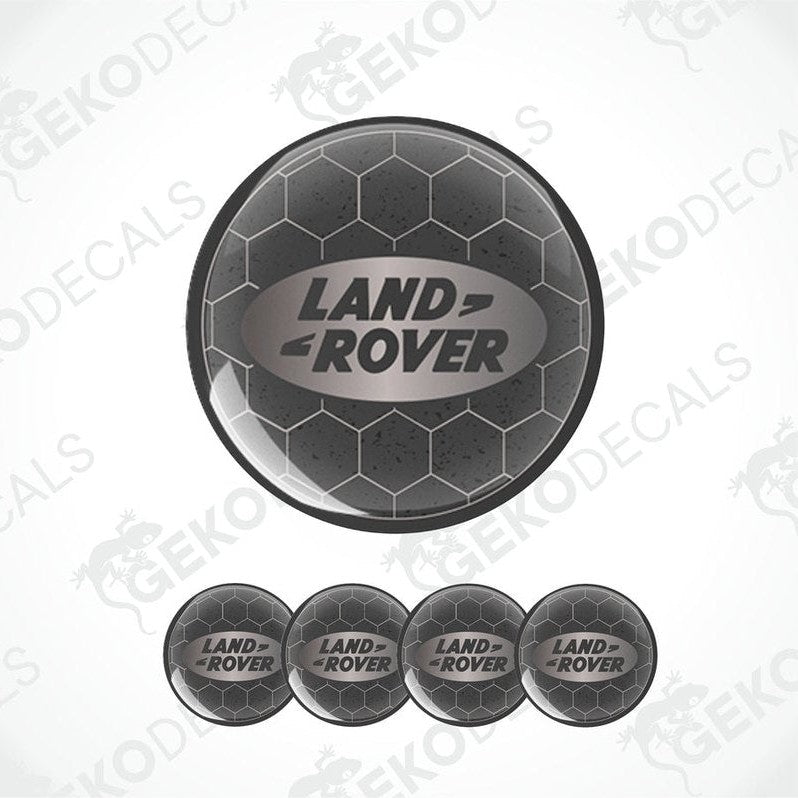 A set of four black vinyl stickers with the 'LAND ROVER' text embossed on them, displayed against a white background.