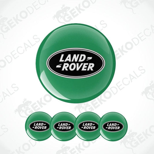 A set of four green vinyl stickers with the 'LAND ROVER' brand logo on them, designed for use as car decals.