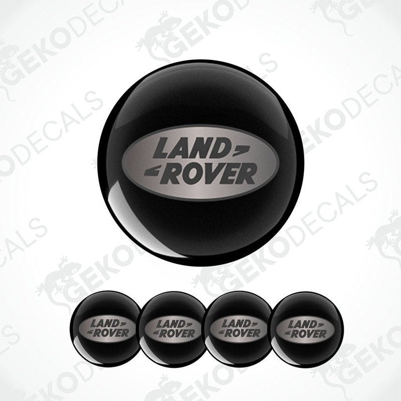 Set of four black round car decals with the LAND ROVER logo in the center.
