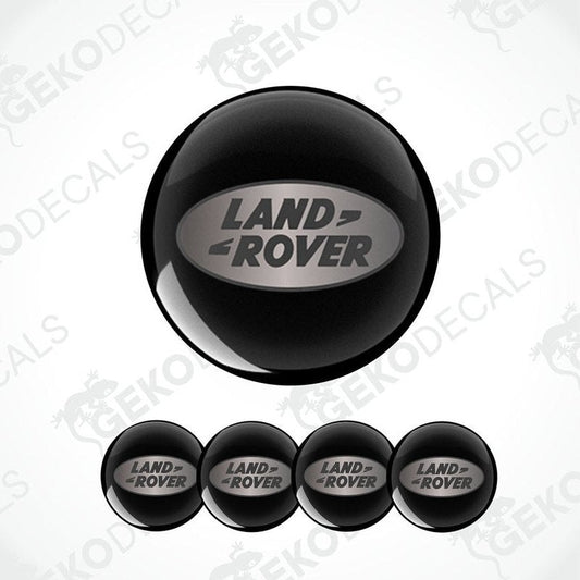 Set of four black round car decals with the LAND ROVER logo in the center.