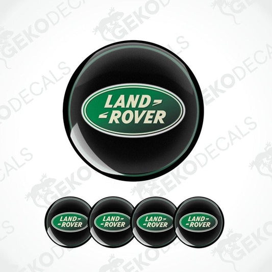 Set of four round vehicle decals with the Land Rover logo in green and white on a black background.