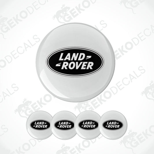 A set of four round car decals with the Land Rover logo in black on a white background.