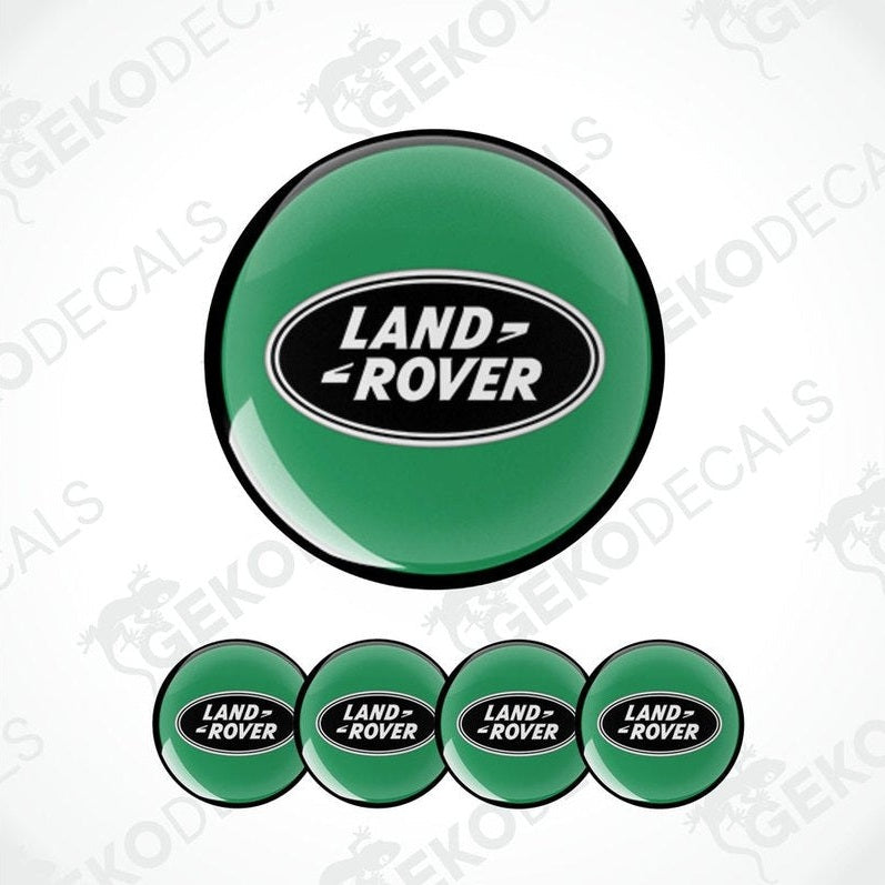 A set of four green vinyl stickers with the 'LAND ROVER' brand logo on them, designed for use as car decals.