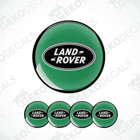 A set of four green vinyl stickers with the 'LAND ROVER' brand logo on them, designed for use as car decals.