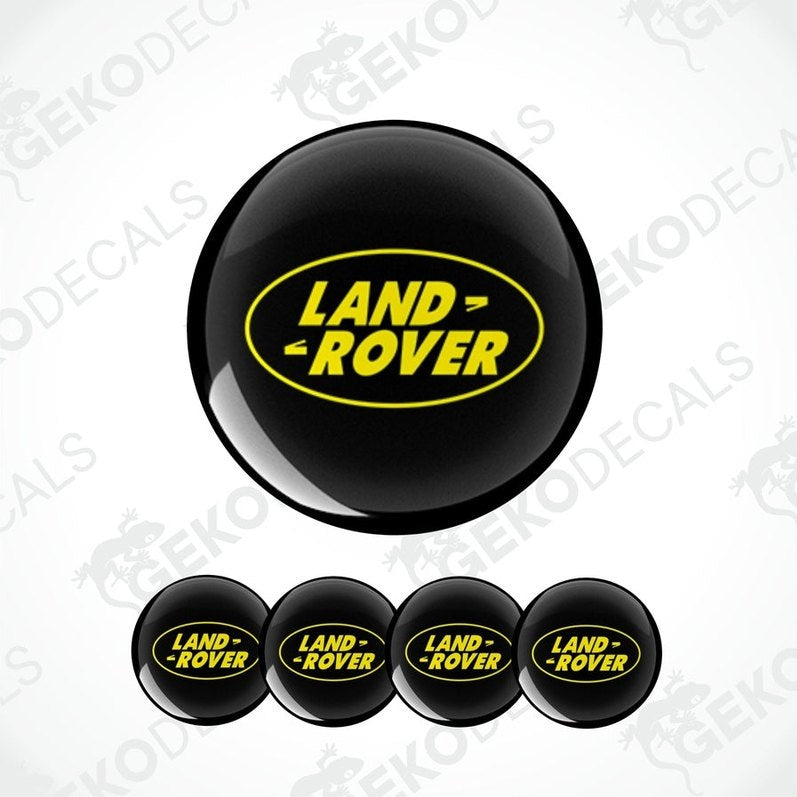 Set of four black and yellow vinyl decals with the 'LAND ROVER' logo.