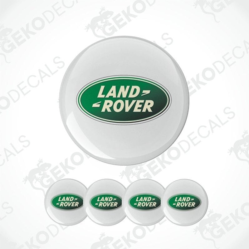 A set of four white vinyl stickers with the 'Land Rover' brand logo in green, displayed on a white background.
