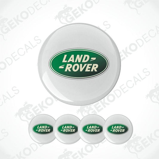 A set of four white vinyl stickers with the 'Land Rover' brand logo in green, displayed on a white background.