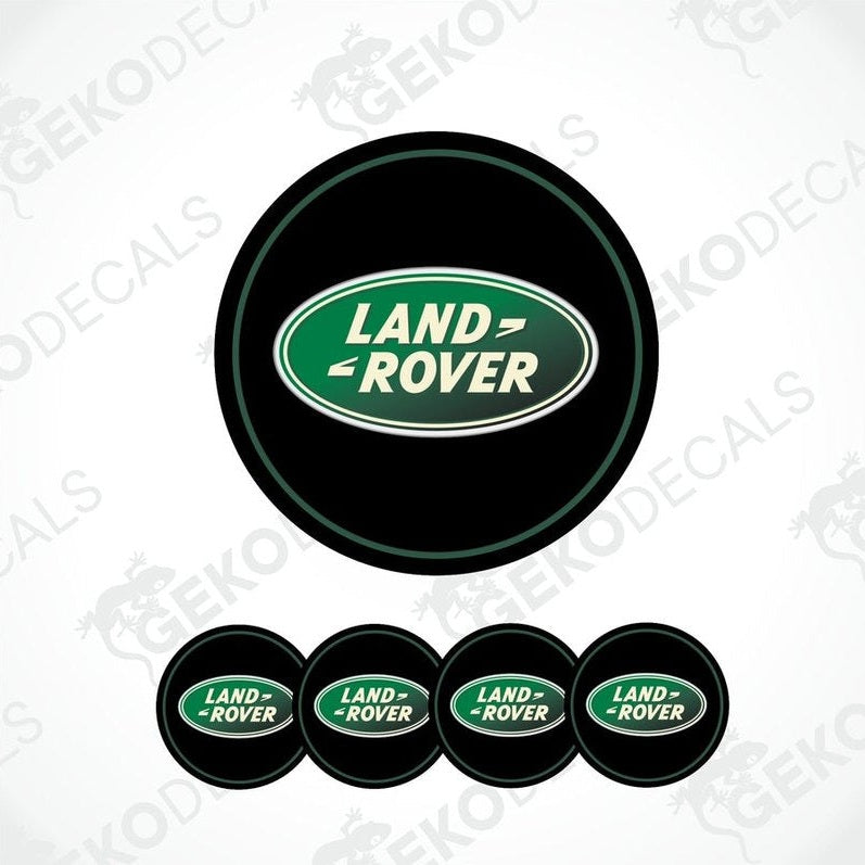 Set of four round vehicle decals with the Land Rover logo in green and white on a black background.