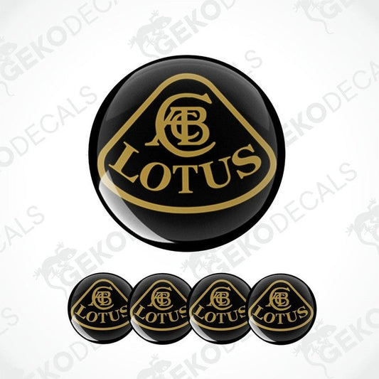 A set of black and brown vinyl decals with the Lotus logo, including four round decals and one larger oval decal.