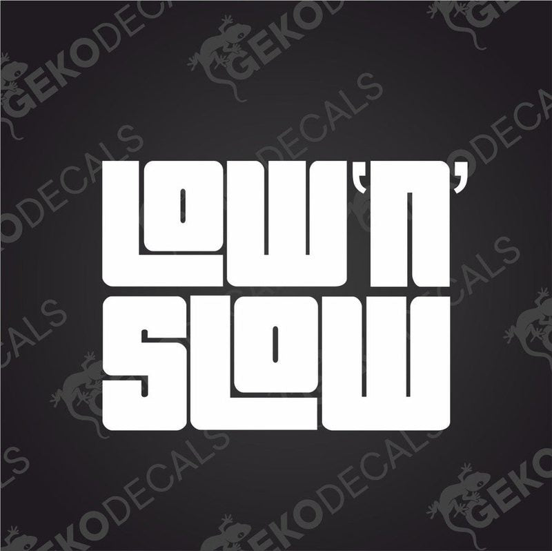 White LOW N SLOW die cut car decal with bold geometric sans-serif lettering on dark background