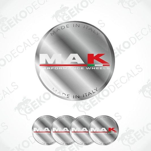 A set of four silver-colored vinyl stickers with 'MAK PERFORMANCE WHEELS' text and a red and black design, indicating they are made in Italy.