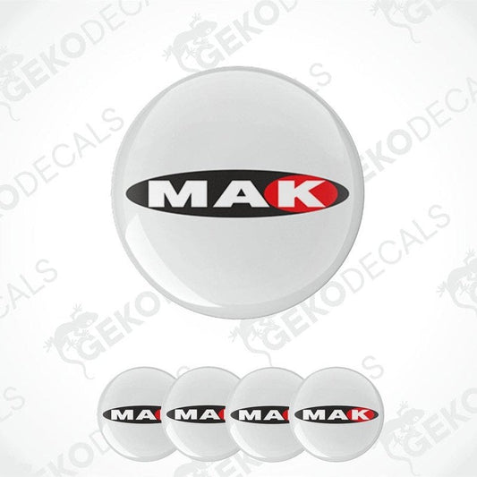 A set of four white vinyl stickers with the MAK brand logo in black and red.
