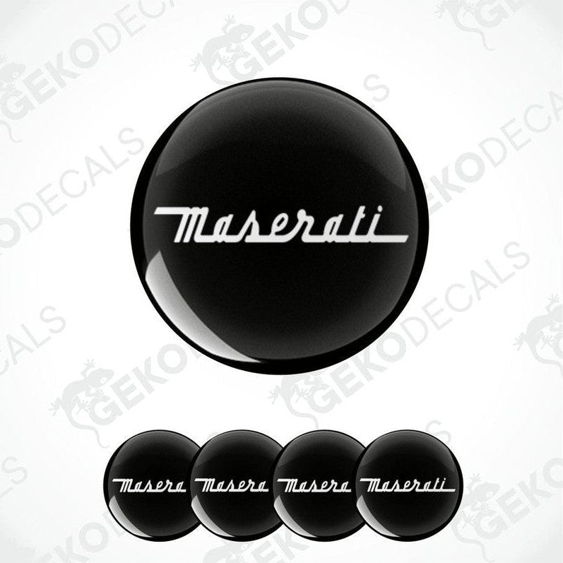 A set of four black vinyl decals with a white Maserati logo, displayed on a white background.