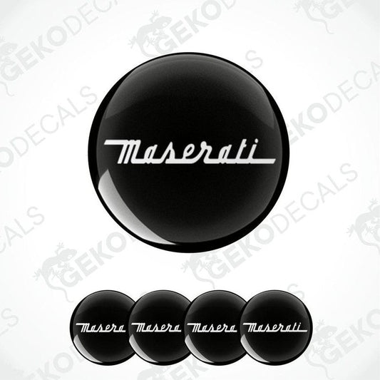 A set of four black vinyl decals with a white Maserati logo, displayed on a white background.