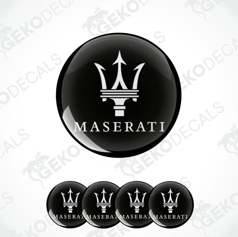 Set of four black vinyl decals with the Maserati logo applied on them, designed for use as car wheel caps.