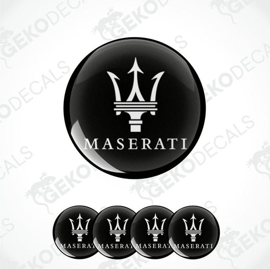 Set of four black vinyl decals with the Maserati logo applied on them, designed for use as car wheel caps.