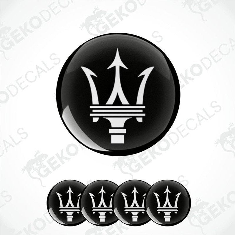 Set of four black vinyl decals with the Maserati logo applied on a white background.