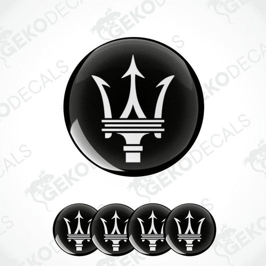 Set of four black vinyl decals with the Maserati logo applied on a white background.