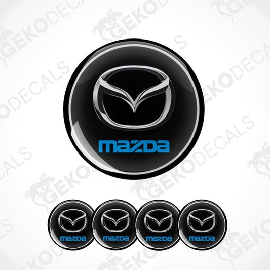 A set of black vinyl decals with the Mazda logo in silver and blue.