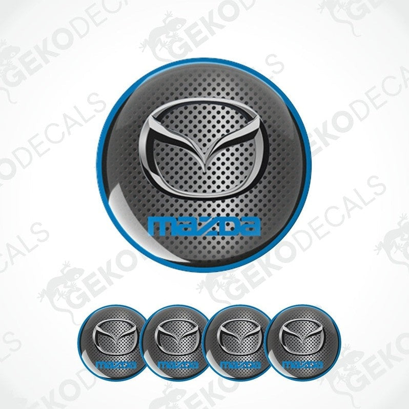 A set of vinyl decals with polyurethane coating featuring the Mazda logo, displayed on a white background.