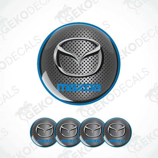 A set of vinyl decals with polyurethane coating featuring the Mazda logo, displayed on a white background.