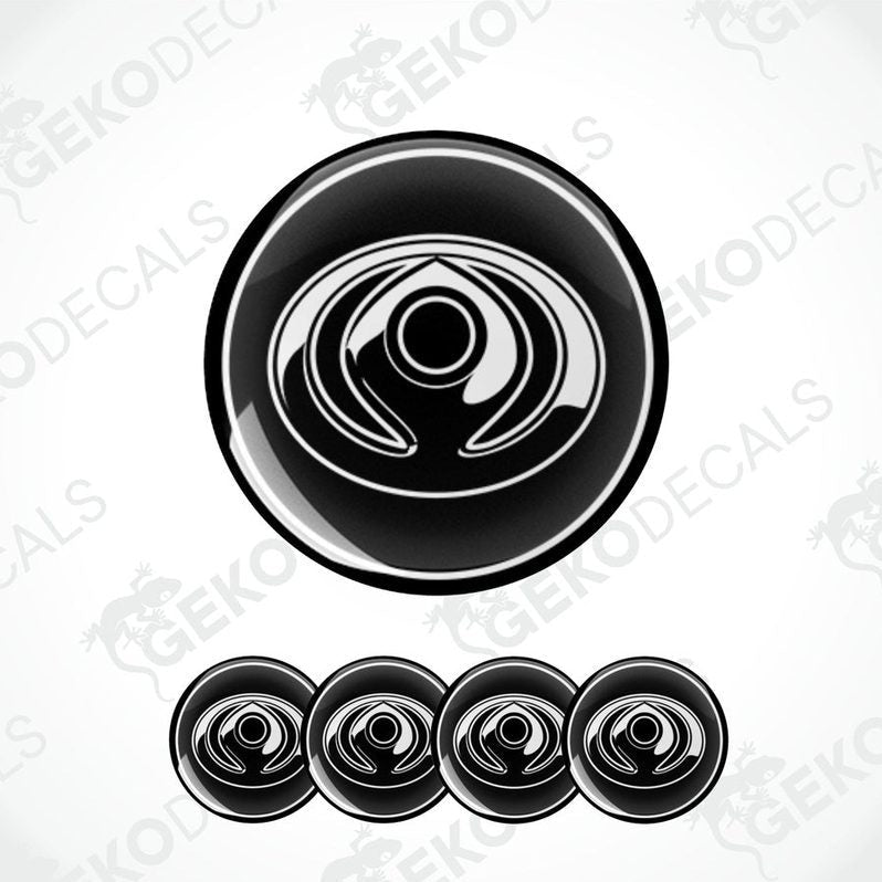 A set of four black vinyl decals with a polyurethane coating and a spiral design, branded for Mazda.