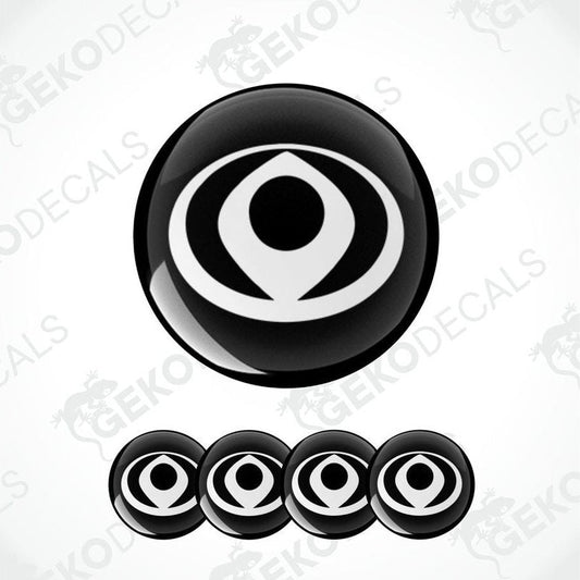A set of four black and white circular vinyl stickers with a geometric design, associated with the brand MAZDA.
