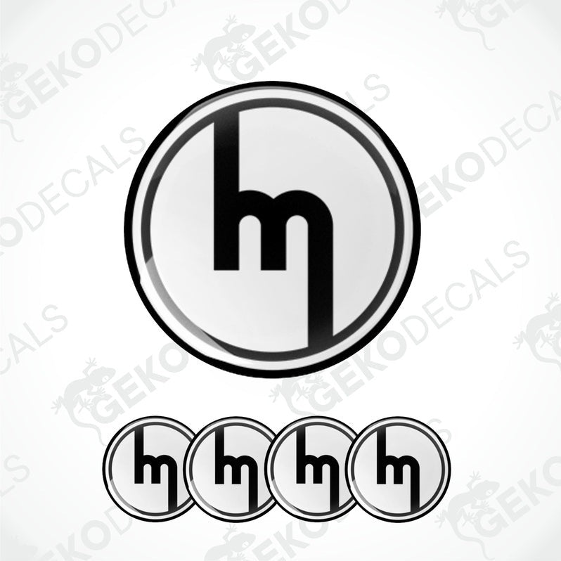 A set of four black and white vinyl decals with the MAZDA logo design.