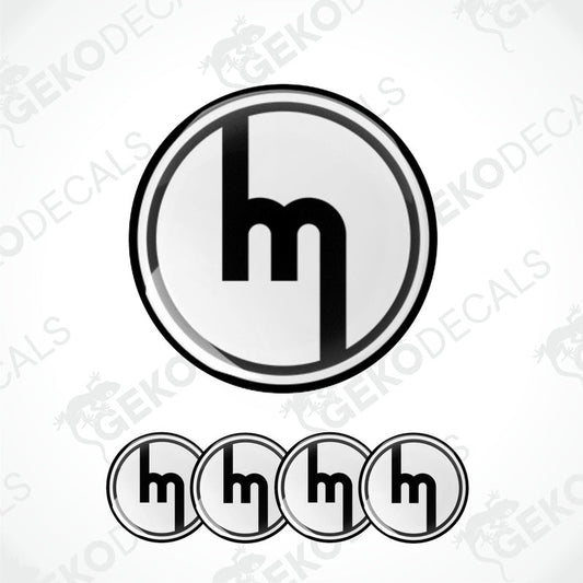 A set of four black and white vinyl decals with the MAZDA logo design.