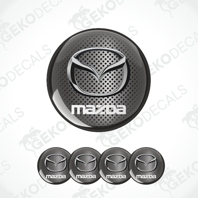 A set of four black vinyl stickers with a Mazda logo design, intended for use as car decals.