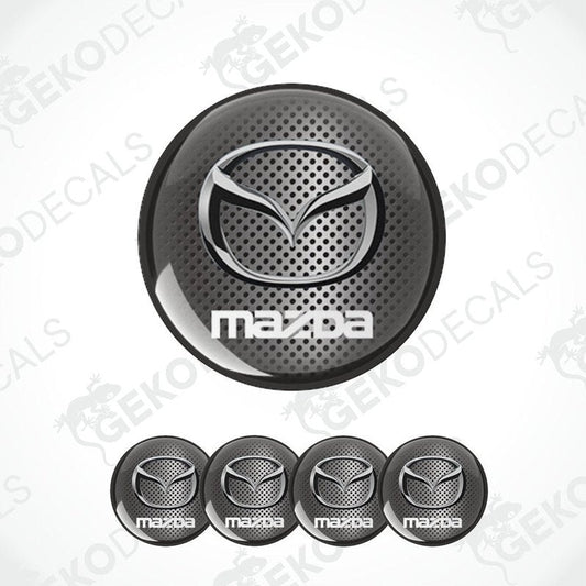 A set of four black vinyl stickers with a Mazda logo design, intended for use as car decals.