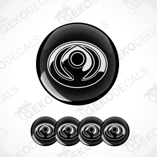 A set of four black vinyl decals with a polyurethane coating and a spiral design, branded for Mazda.