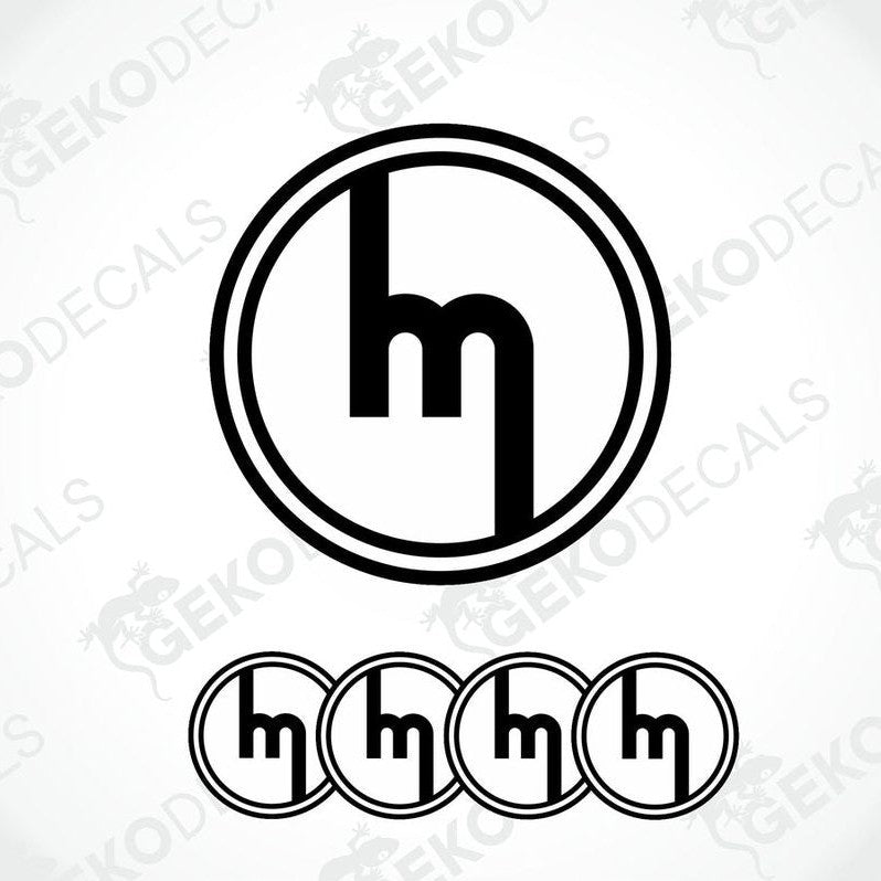A set of four black and white vinyl decals with the MAZDA logo design.