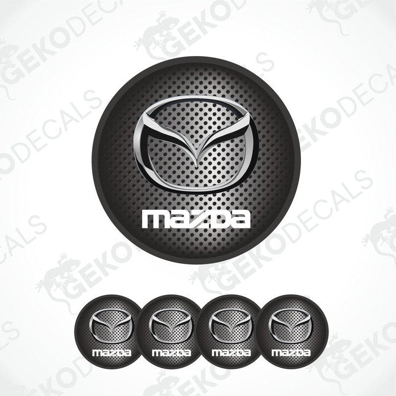 A set of four black vinyl stickers with a Mazda logo design, intended for use as car decals.