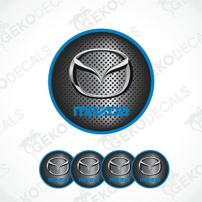 A set of vinyl decals with polyurethane coating featuring the Mazda logo, displayed on a white background.