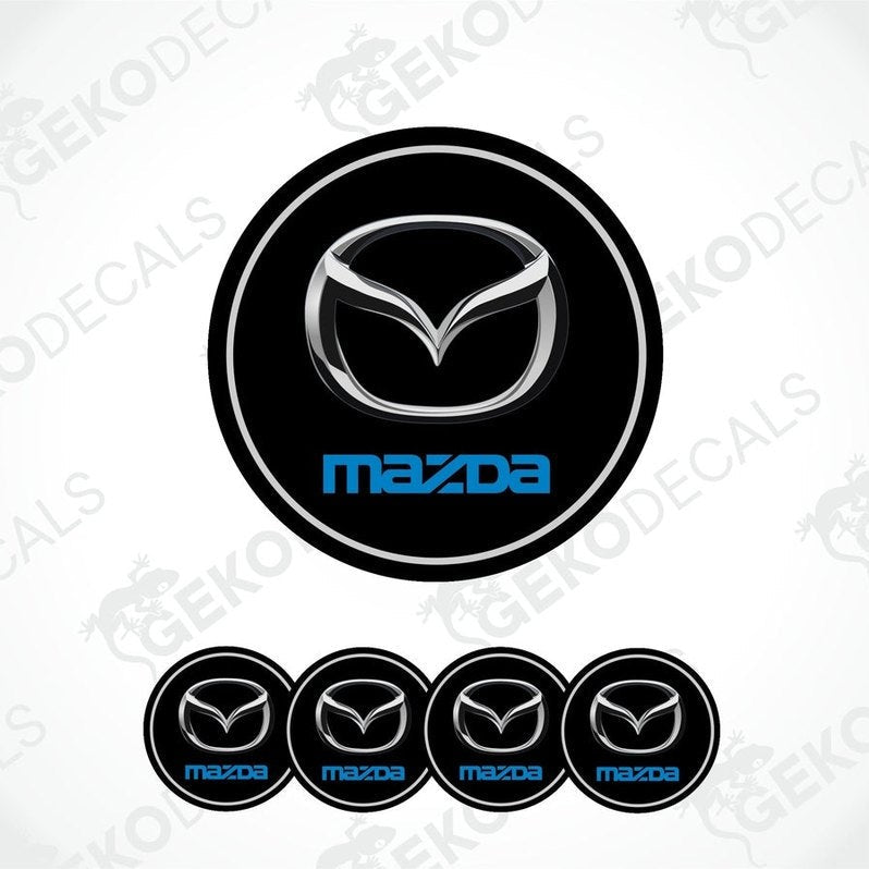 A set of black vinyl decals with the Mazda logo in silver and blue.