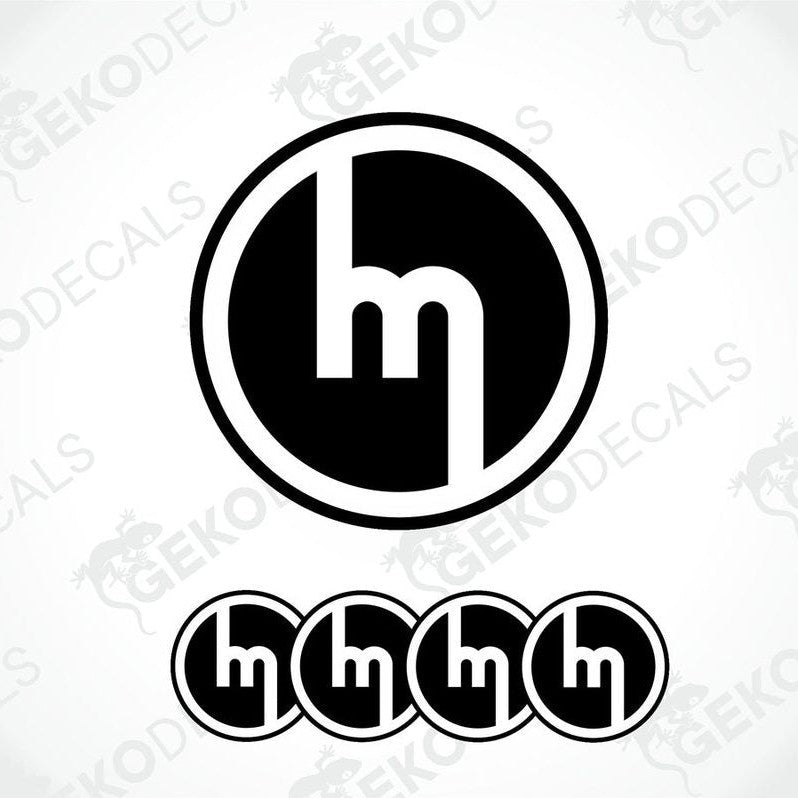 A set of four black and white vinyl decals with the MAZDA logo design.