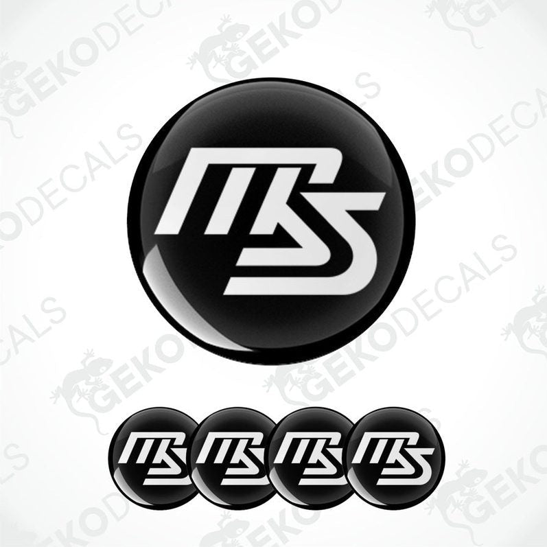 A set of four black and white vinyl decals with the MAZDASPEED logo.