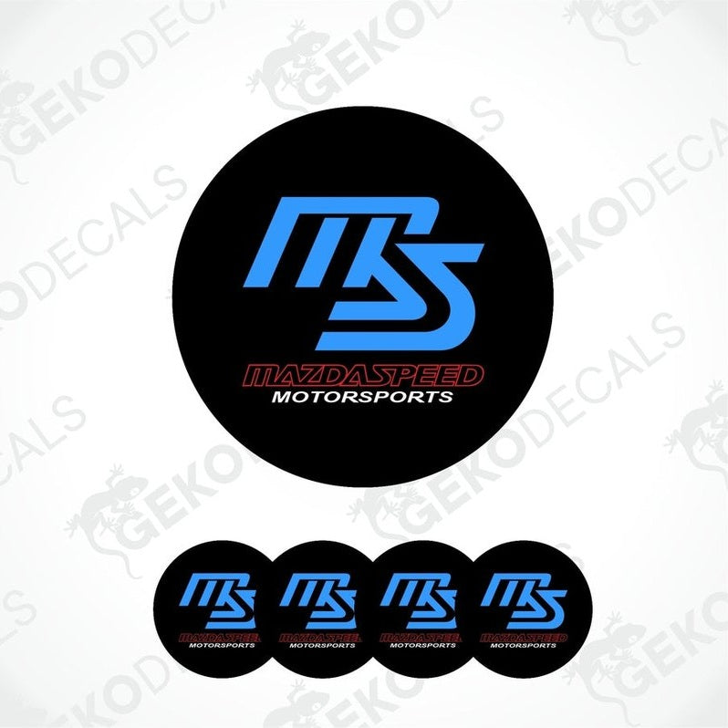 A set of four black, blue, and red vinyl decals with the text 'MAZDASPEED' and 'MOTORSPORTS', designed for use as car wheel caps or stickers.