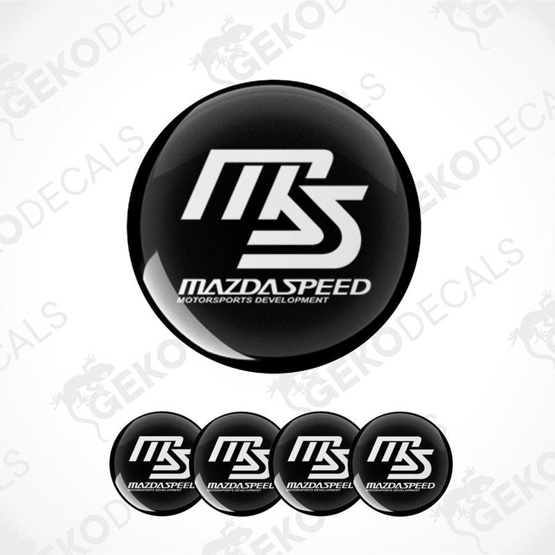 A set of black and white vinyl decals with the MAZDASPEED logo.