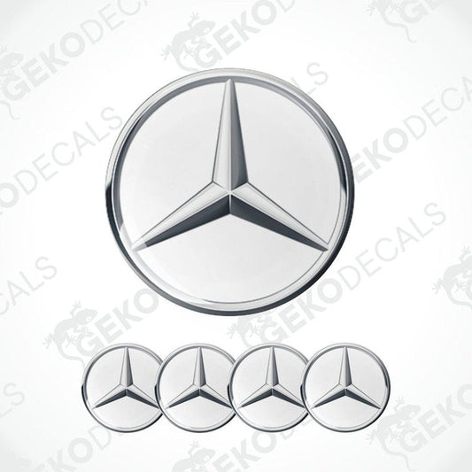 A set of four silver Mercedes-Benz emblem stickers with a polyurethane coating, displayed against a white background.