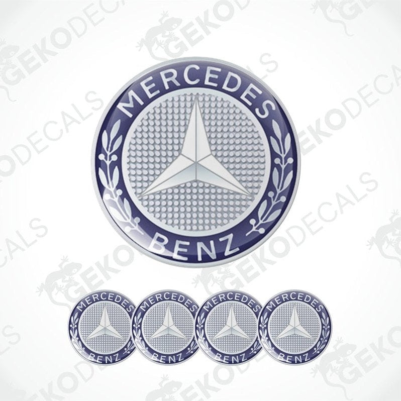 A set of four silver Mercedes-Benz branded vinyl stickers with a polyurethane coating, displayed against a white background.