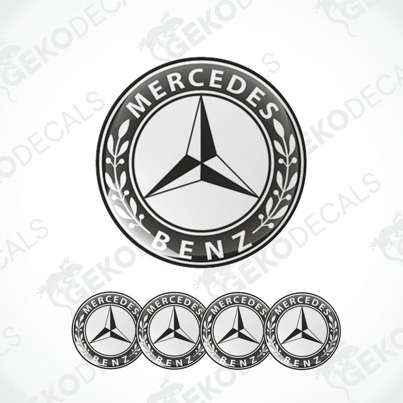 A set of four black and white vinyl decals with a polyurethane coating featuring the Mercedes-Benz star logo.