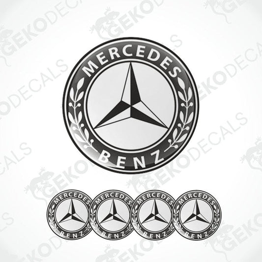 A set of four black and white vinyl decals with a polyurethane coating featuring the Mercedes-Benz star logo.