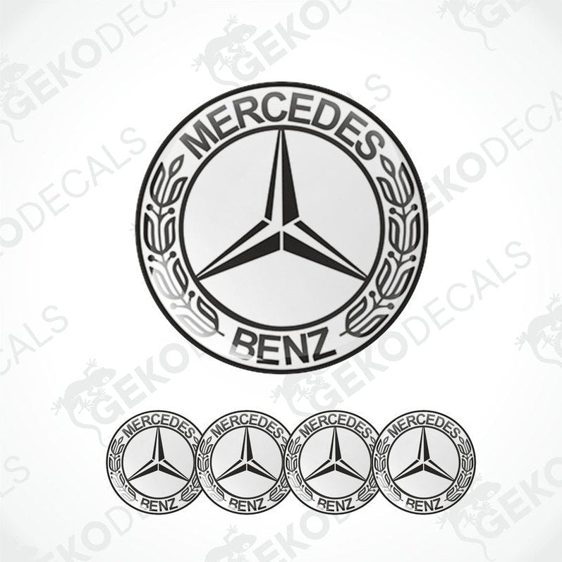 A set of four black and white vinyl decals with a polyurethane coating featuring the Mercedes-Benz star logo.