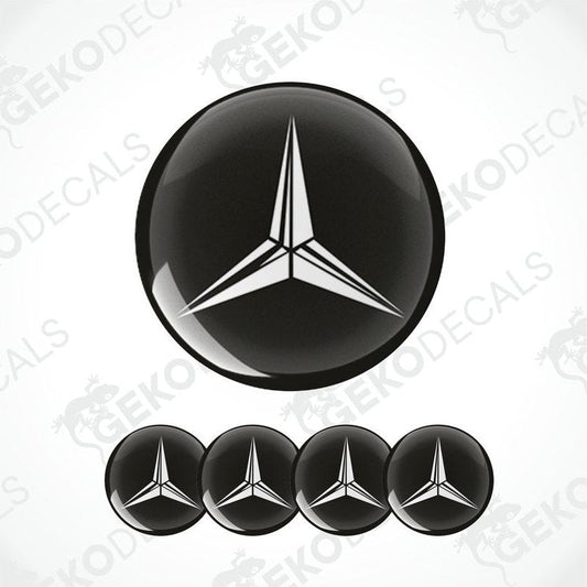 A set of four black and white vinyl stickers with a geometric design, including a prominent Mercedes-Benz logo.