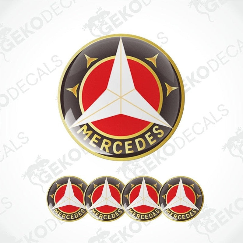 A set of four vinyl stickers with a Mercedes-Benz logo in red, white, and black colors.