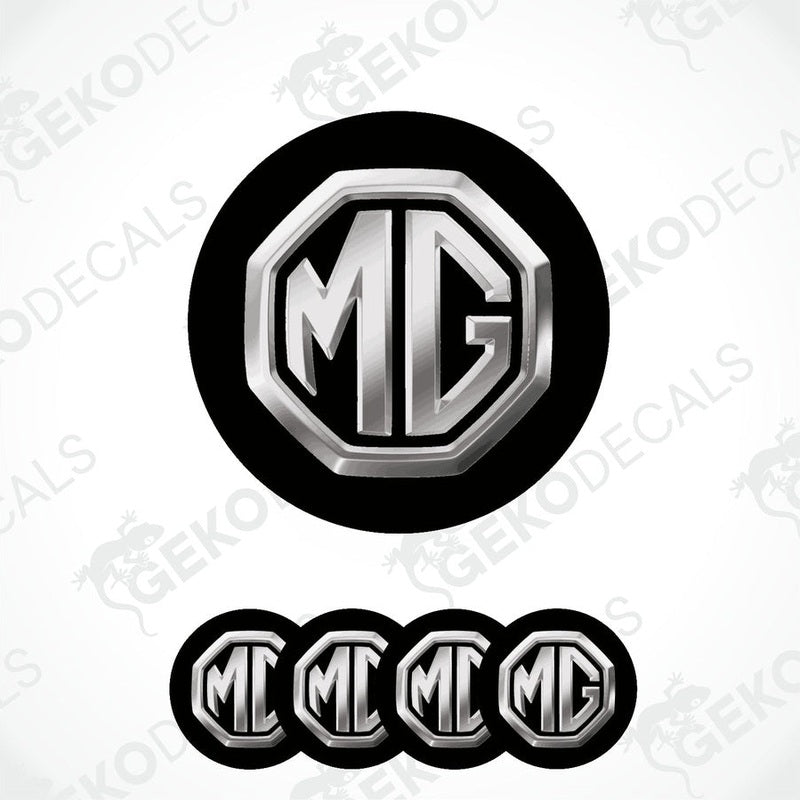 A set of four black and silver vinyl decals with the MG logo, designed for use as car wheel caps.